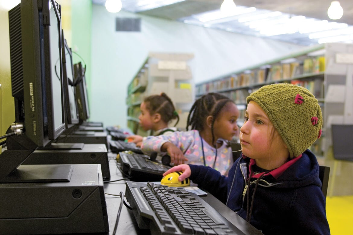 Young kids on computers in the Seattle Public Library