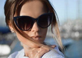 Woman in sunglasses outside