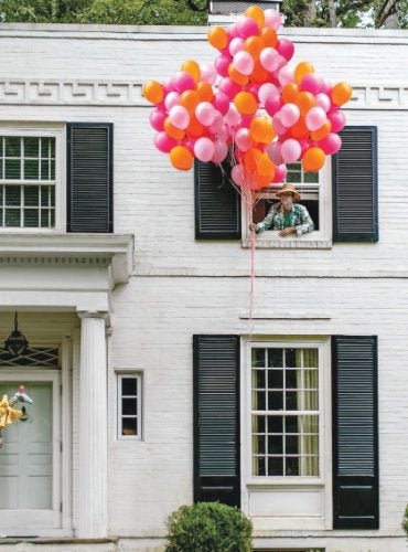 Jason Oliver Nixon and John Loecke in front of their North Carolina Regency-style home