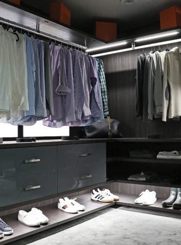 Dark modern walk in closet