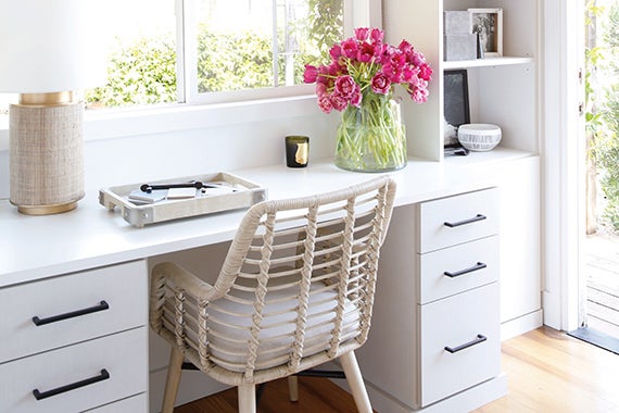 Office space with white desk and dark aged hardware