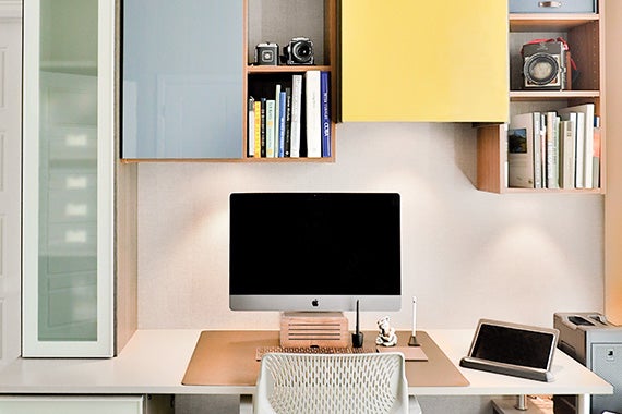Creative office space with computer and desk stand for iPad