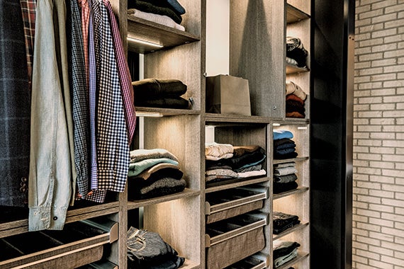 Stunning Closet with Accent Lighting in Light Brown Finish