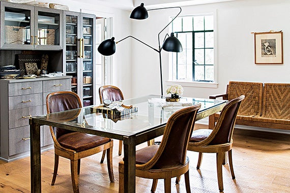 Glass dining table with leather seating