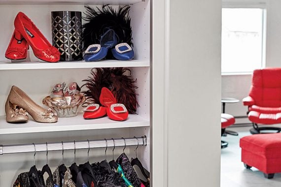 Classic white finish storage space with shoes and clothes
