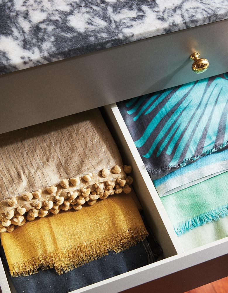 Granite Countertop closet with folded linens