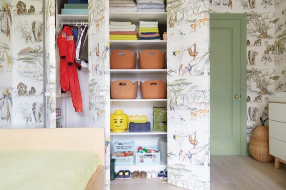 Closet with colorful bins
