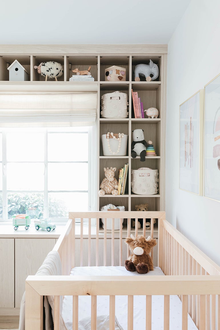 Baby crib on the side of the room