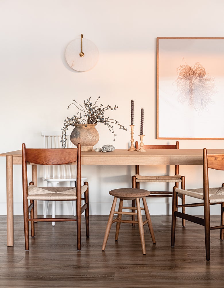 Erin Hiemstra kitchen dining area with original prints in background