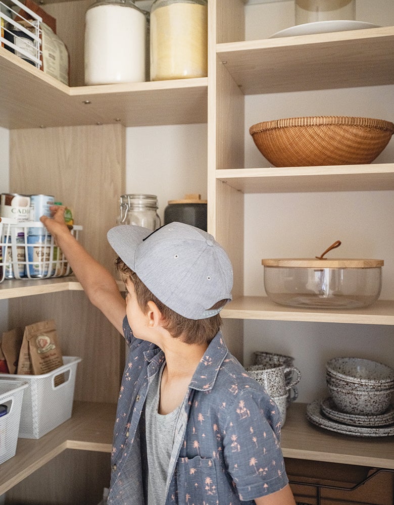 Kitchen pantry larder in wood grain finish created for Erin Hiemstra by California Closets