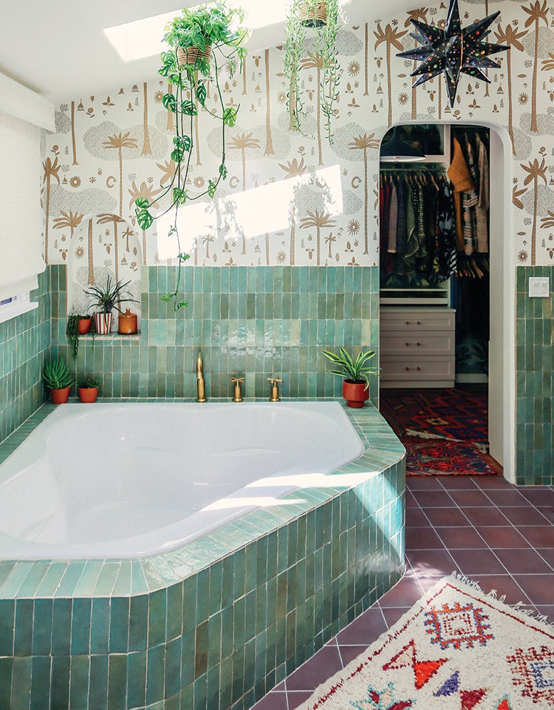 Justina Blakeney's master bathroom designed with colorful tile and wallpaper with custom storage