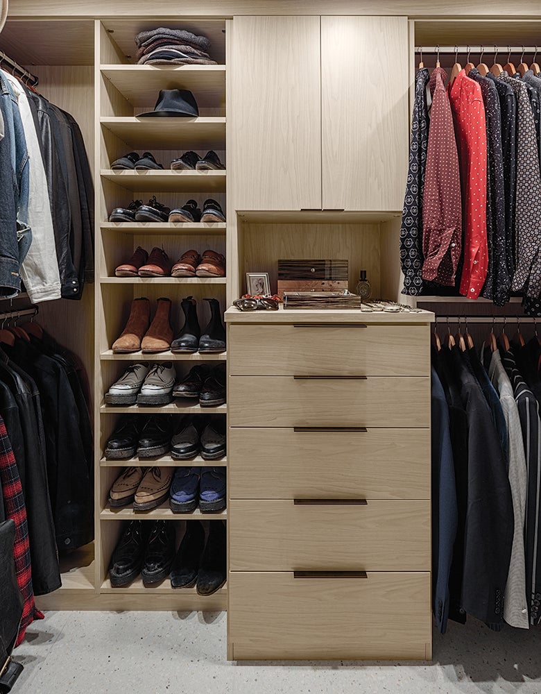 The before closet was redesigned for Matt Sorum to two walk in closets in wood grain finishes created by California Closets